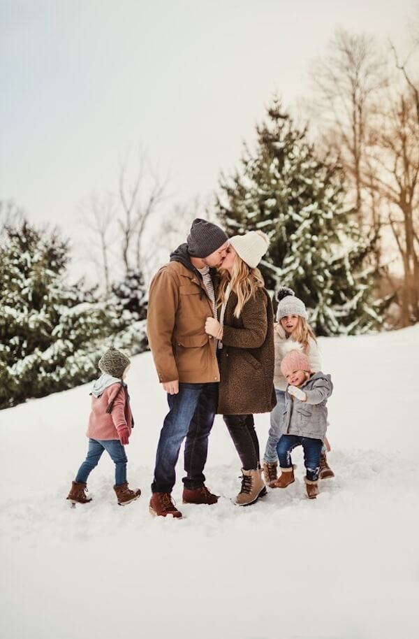Parents Kissing While Kids Play