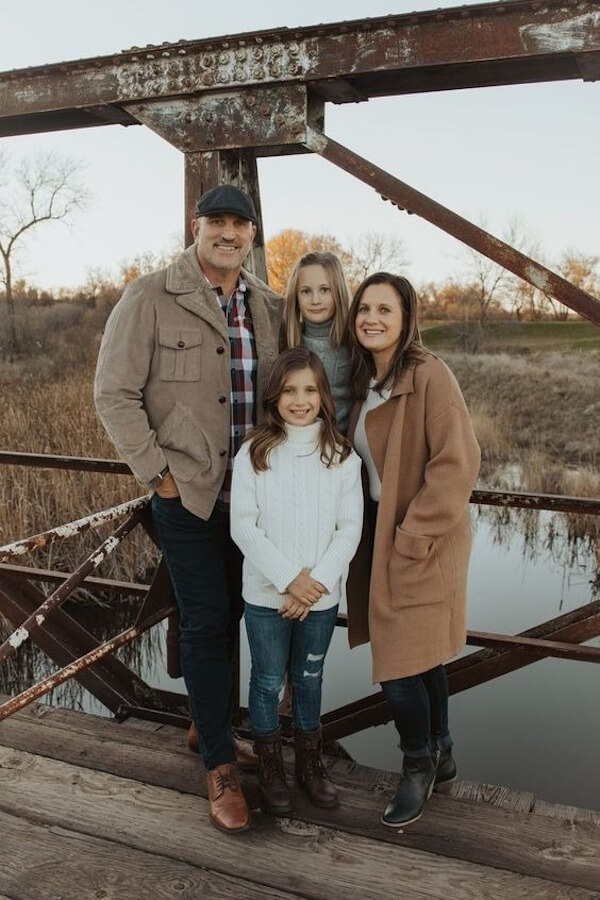 Candid Family Photo on a Rustic Bridge