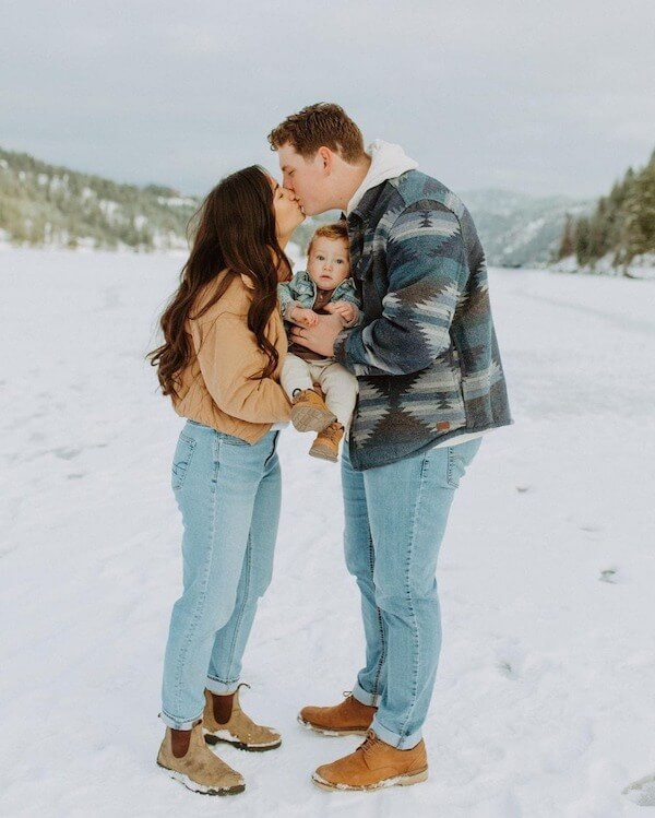 Family Kiss With Baby In The Middle
