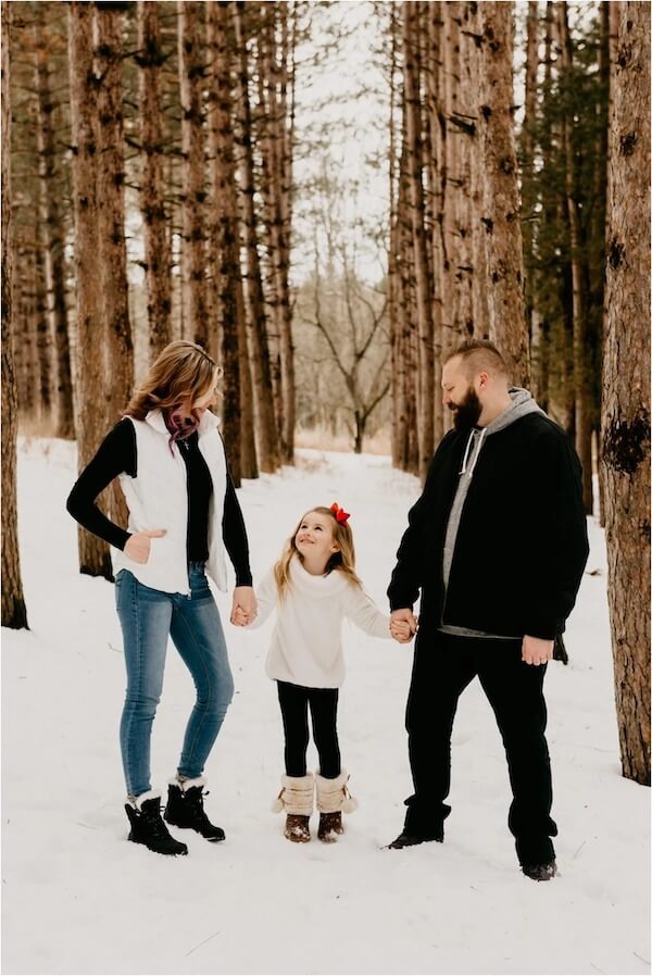 Holding Hands in a Winter Forest