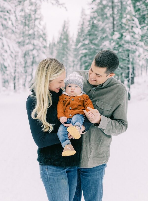 Parents Holding Baby for Winter Photo