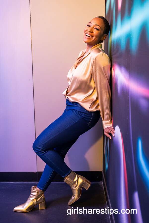 Silk Champagne Blouse with Fitted Jeans and Gold Boots