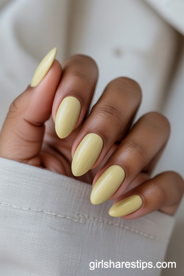 Almond Pastel Yellow Nails with Minimalist Dotted Design