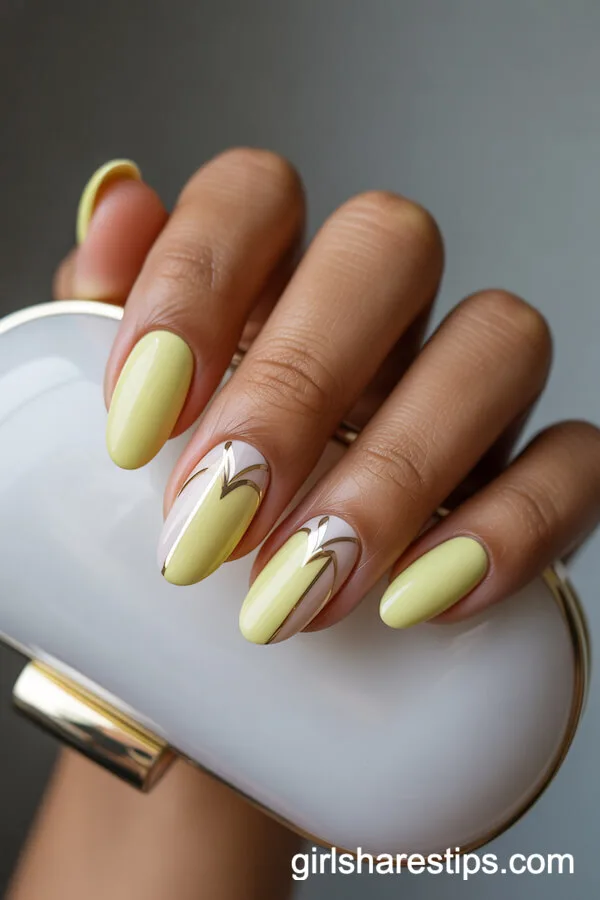 Pastel Yellow Oval Nails with White and Gold Art Deco Accents