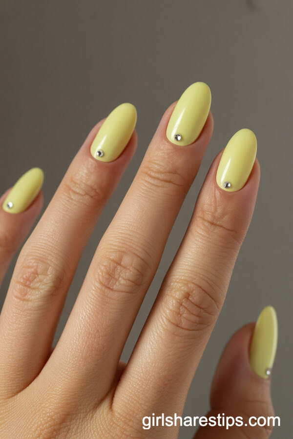Oval Pastel Yellow Nails with Rhinestone Base Accents