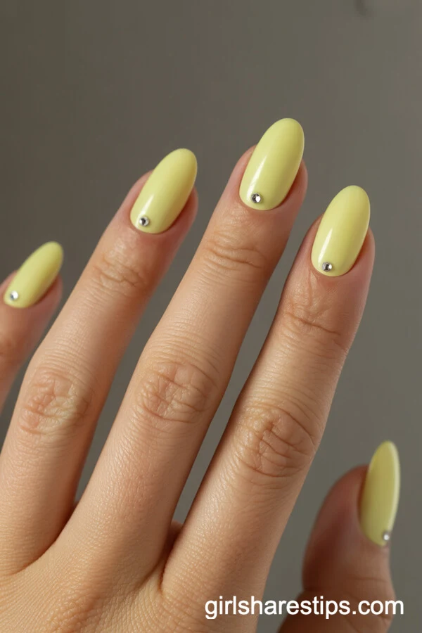 Oval Pastel Yellow Nails with Rhinestone Base Accents
