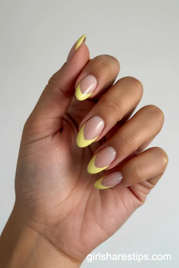 Almond Pastel Yellow Nails with Heart-Shaped French Tips