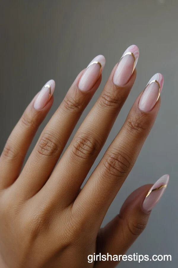 Marble-Effect Pink French Tips with Hand-Drawn Gold Veining