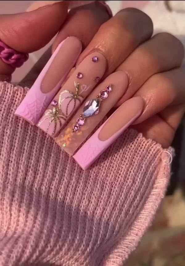 Glam Pink Nails with Rhinestones and Pumpkin Designs