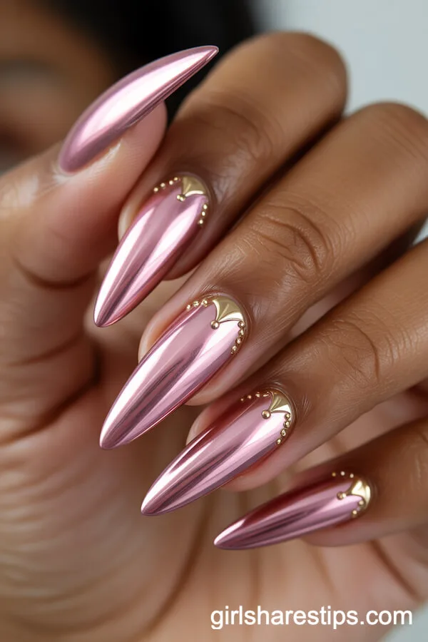 Long Pink Chrome Stiletto Nails with Subtle Gold Accents