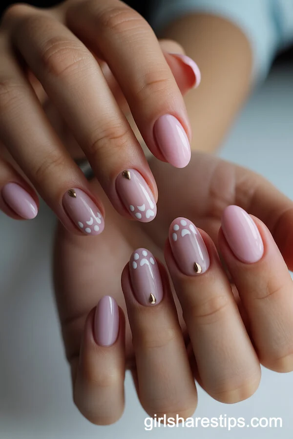 Soft Pink Oval Nails with Cat Paw Prints and Gold Accents