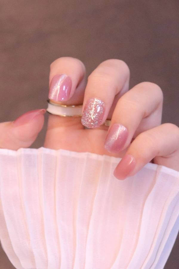 Pink Cat Eye Nails with Glitter Accent