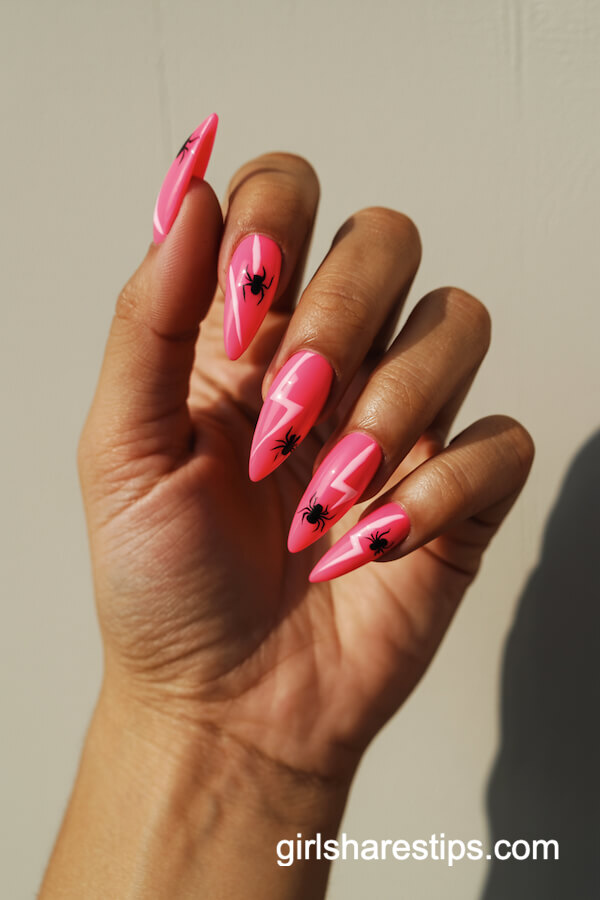 Neon Pink Stiletto Nails with Lightning Bolts and Spiders