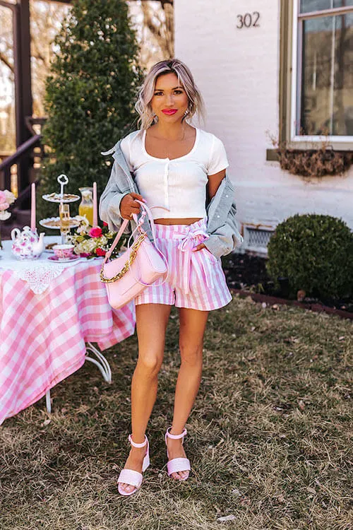 denim jacket and high waisted pink shorts