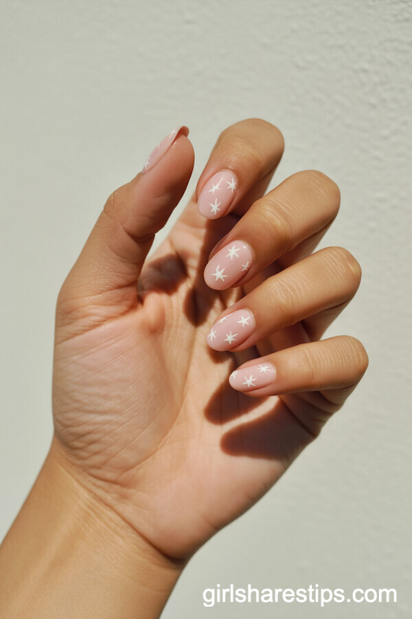 Pink Almond Nails With Tiny White Star Accents