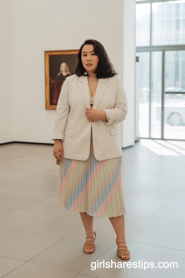 Gallery-Ready: Cream Blazer with Pastel Pleated Skirt