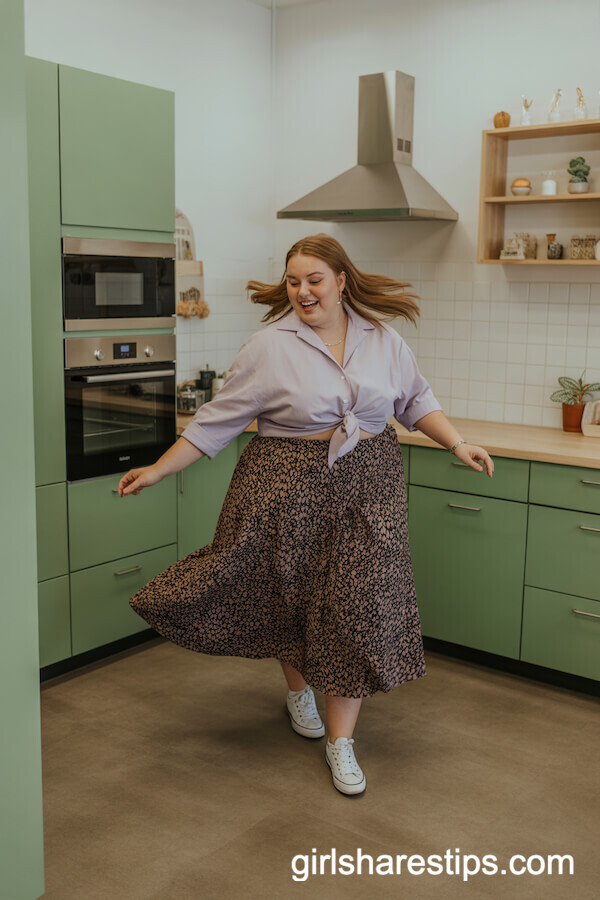 Patterned midi skirt with pastel blouse