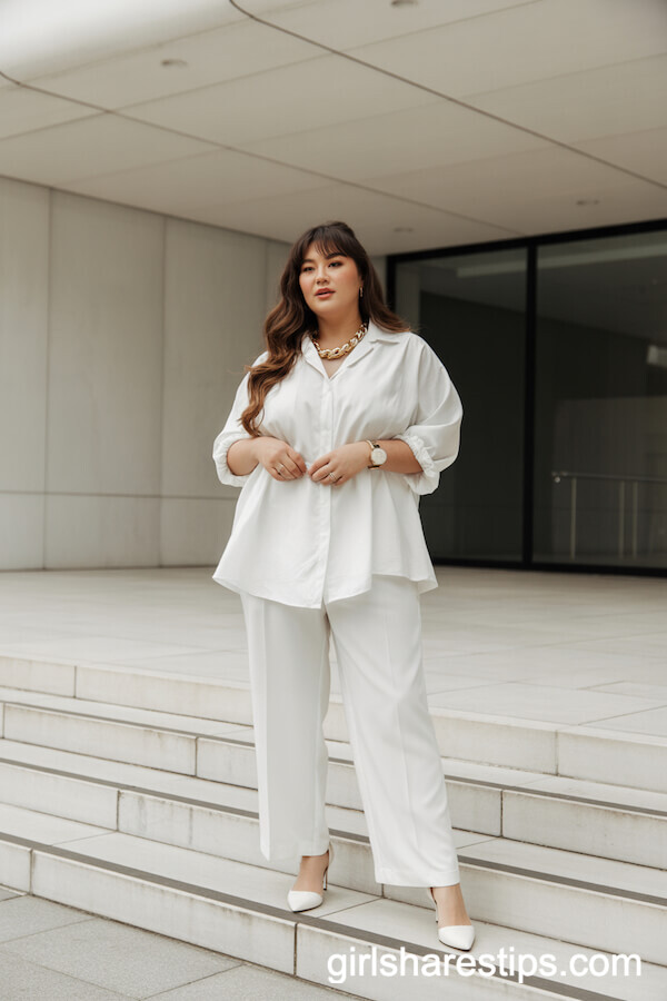 All-White Wide-Leg Trousers and Flowy Blouse Look

Effortlessly chic, this monochromatic ensemble pairs crisp wide-leg trousers with a breezy, flowy blouse for a modern yet timeless silhouette. The high-waisted trousers elongate the legs, while the billowy blouse adds movement and softness. Tuck in the blouse for definition, or leave it slightly undone for a relaxed vibe. Accessorize with minimalist gold jewelry and strappy sandals for daytime, or swap in sleek heels and a structured clutch for evening. Perfect for brunch, office wear, or summer soir&eacute;es, this look balances sophistication with ease.