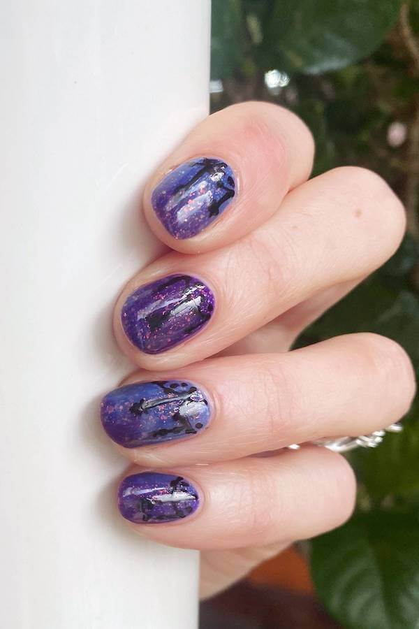 Enchanted Purple Galaxy Nail Design