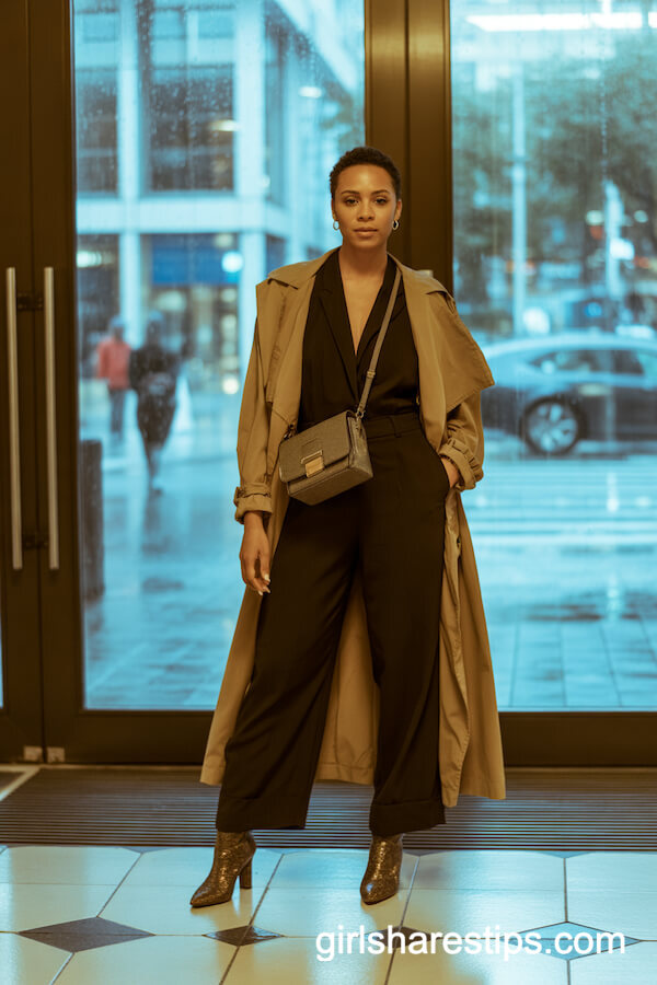 Black jumpsuit with trench coat and heeled booties