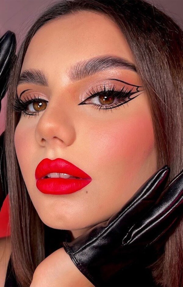 Bold Red Lips with Artistic Graphic Eyeliner