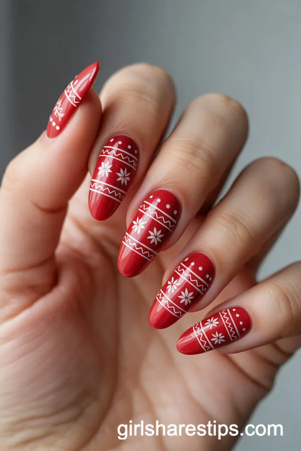 Red Almond Nails with White Christmas Sweater Patterns