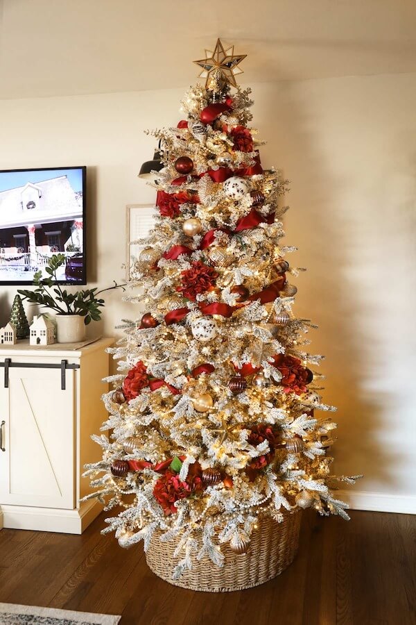 Flocked Christmas Tree with Red and Gold Accents and Ribbon Garland