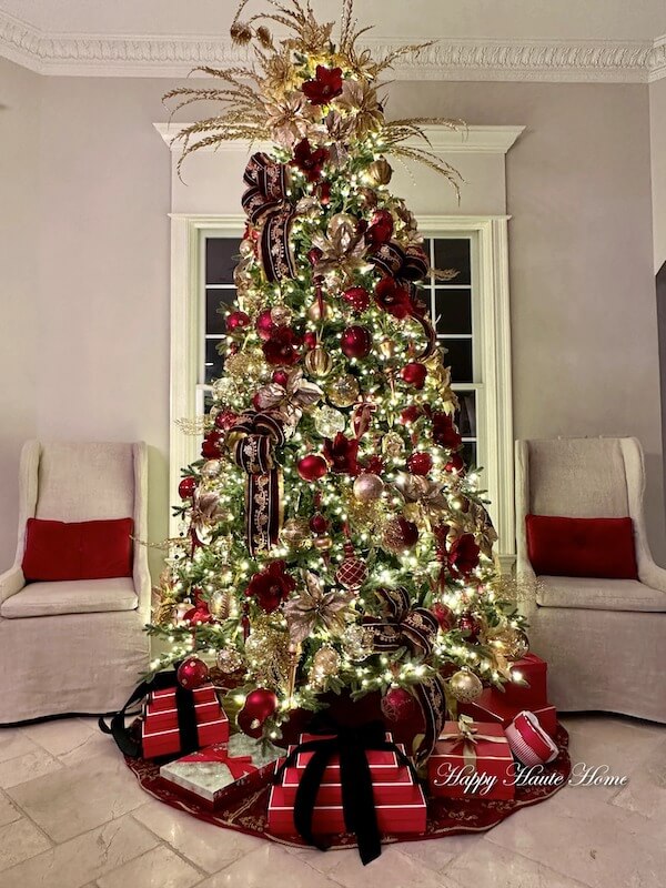 Luxurious Red and Gold Christmas Tree with Statement Ribbons