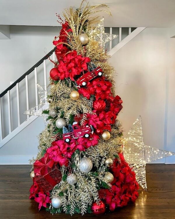 Red and Gold Holiday Tree with Poinsettia Flowers and Star Lights
