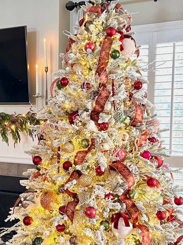 Flacked Christmas Tree with Red and Gold Decorations