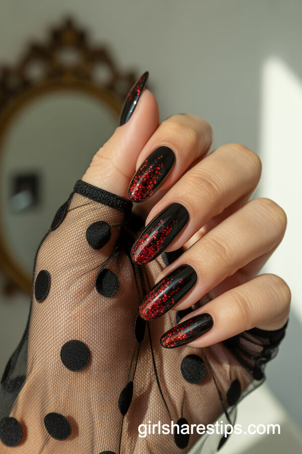 Glossy Black Nails with Red Glitter Drips Over Sheer Gloves