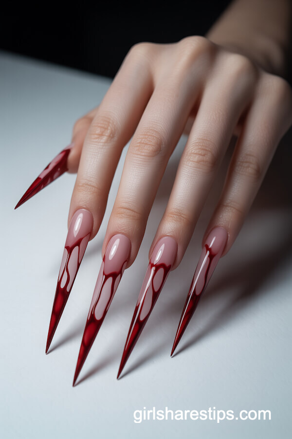 Pinkish-Nude Stiletto Nails with Dramatic Dark Red Blood-Drip Tips