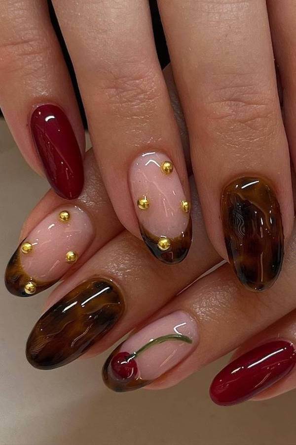 Red and Tortoise Shell Nails with Gold Embellishments