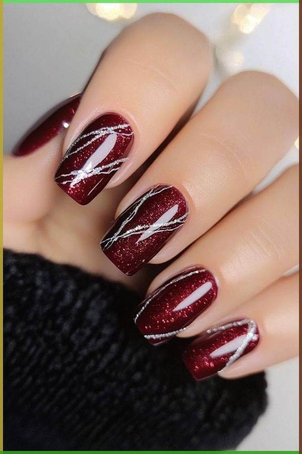 Glittery Red Nails with Silver Swirls