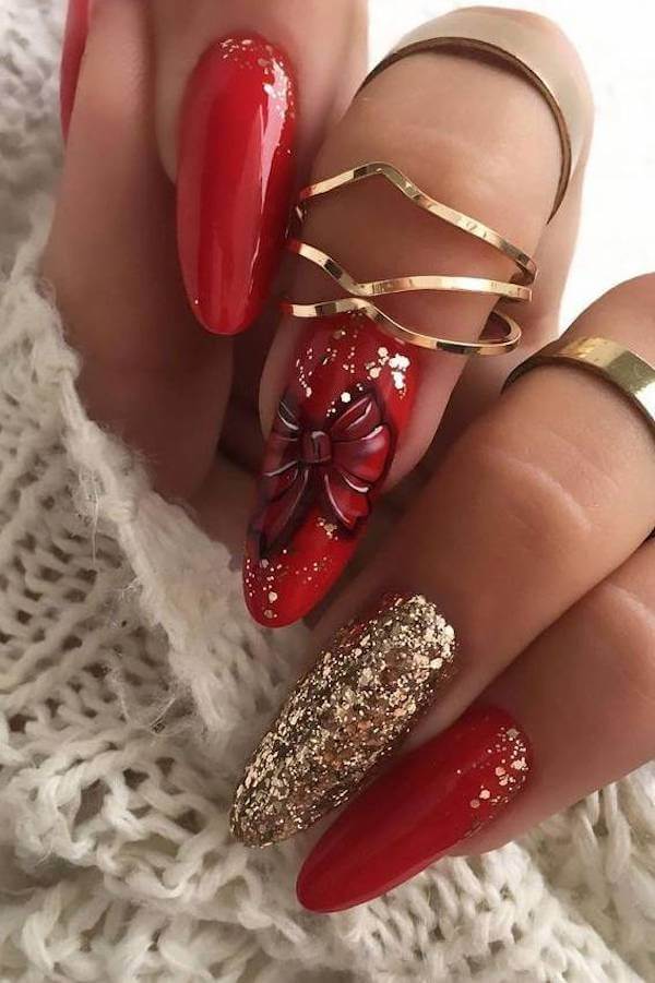 Red Nails with Gold Glitter and Bow Accent