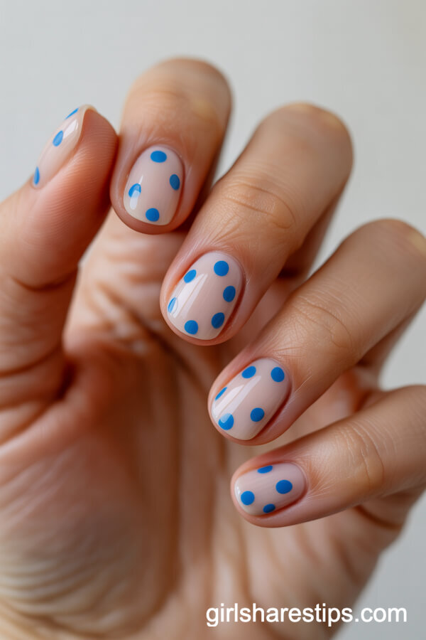 Short Round Nails With Nude Base and Baby Blue Polka Dots