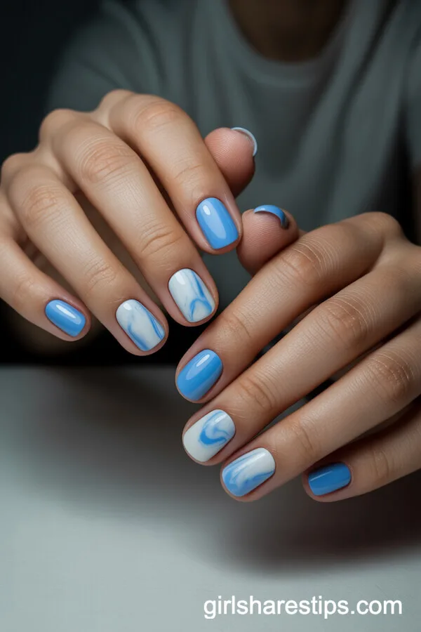 Baby Blue and White Marble Design on Short Round Nails