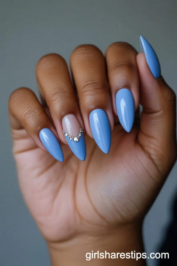 Short Baby Blue Stiletto Nails With Silver Rhinestone Details
