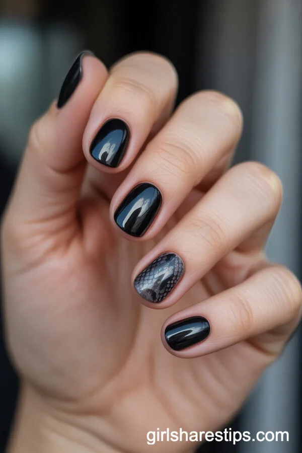 Short Black Round Nails with Snake Print Accent