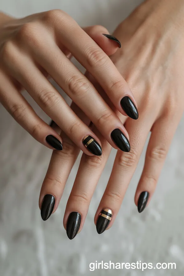 Short Black Almond Nails with Gold Stripe Accent