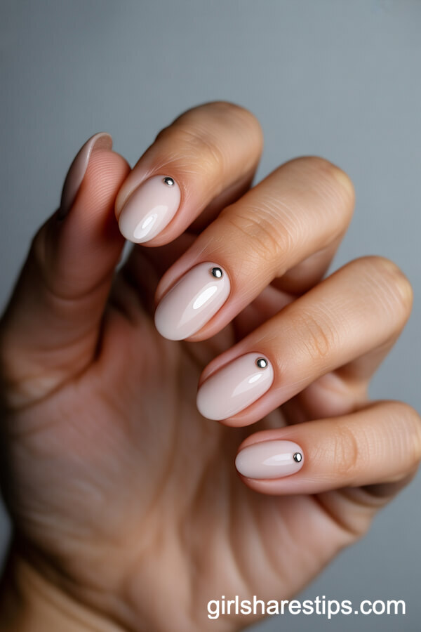Matte Nude Oval Nails with Tiny Silver Studs