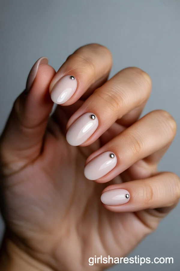 Matte Nude Oval Nails with Tiny Silver Studs