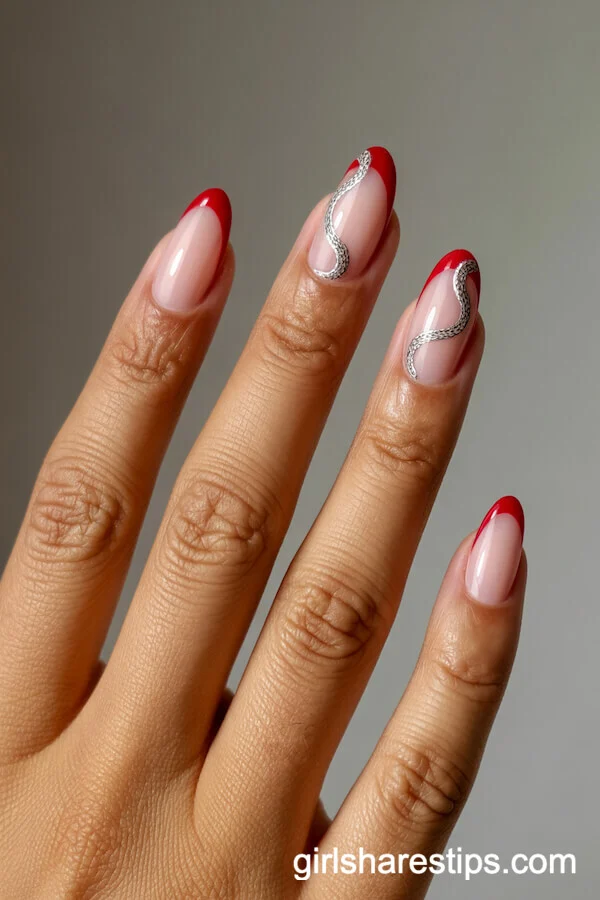 Short Almond Red French Tips with Silver Snake Accents
