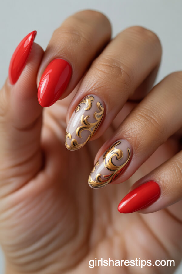 Bright Red Almond Nails with Raised Gold Baroque Swirls