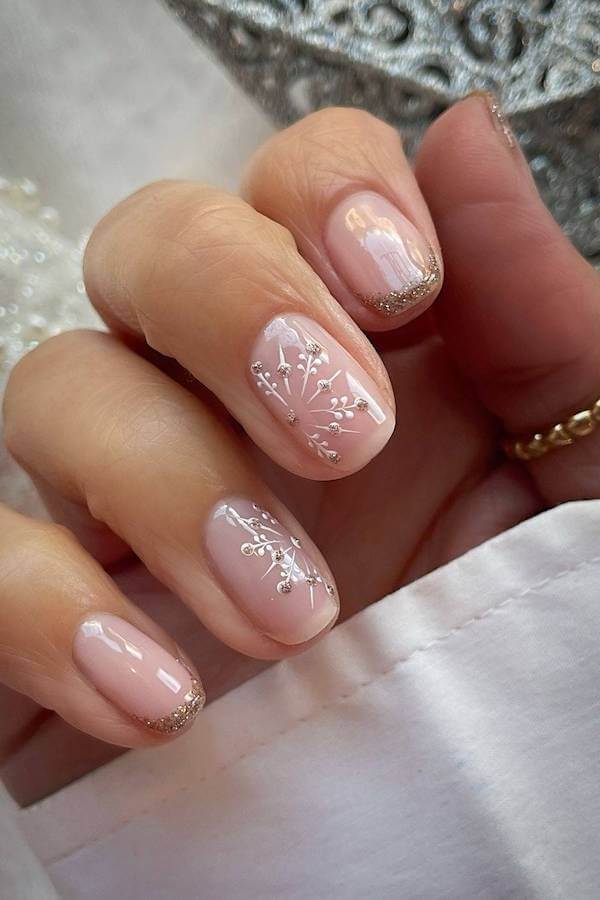 Delicate Gold Snowflake Nails