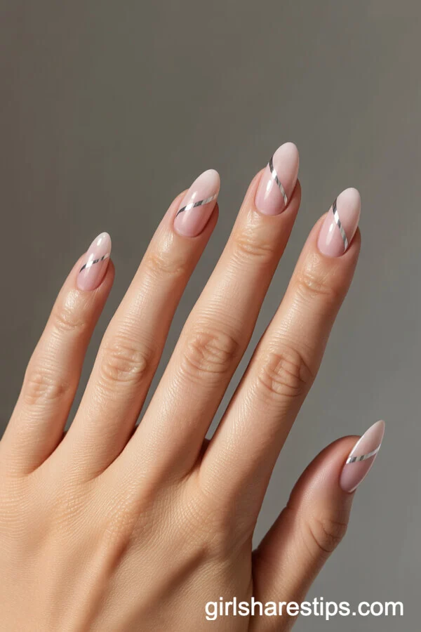 Light Pink Almond Nails with Diagonal Silver Stripes