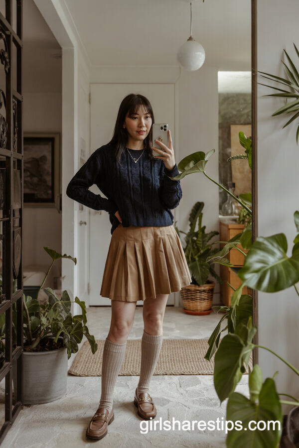 Navy Cable Knit Sweater with Pleated Tan Skirt