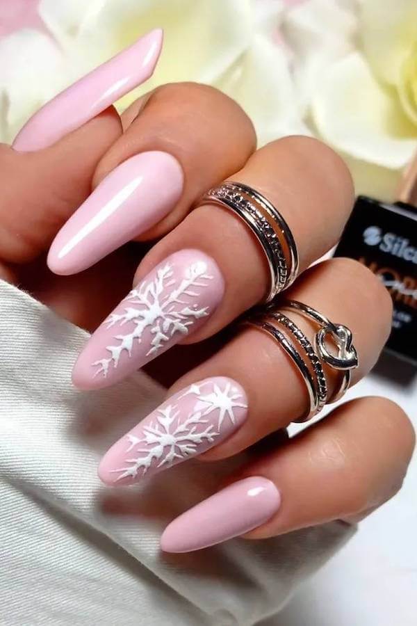 Light Pink Nails With White Snowflakes
