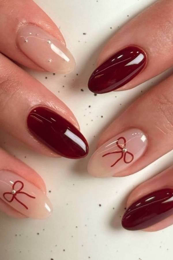 Burgundy And Nude Christmas Bow Nails
