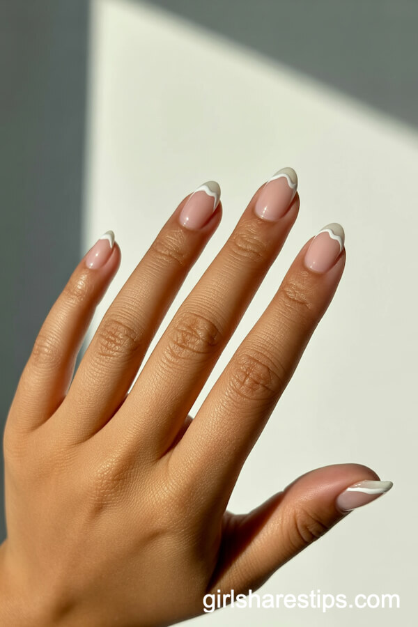 Nude Almond Nails with Delicate White Ocean Wave Tips